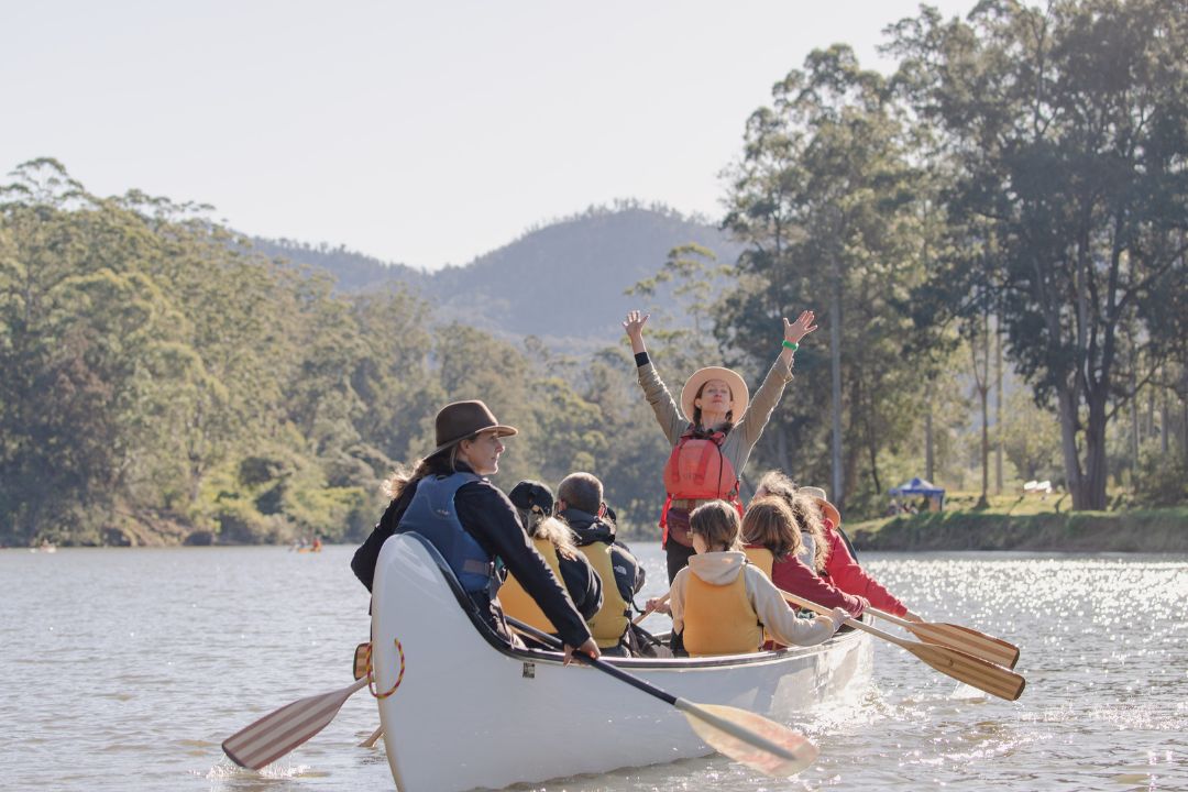 girl standing in canoe